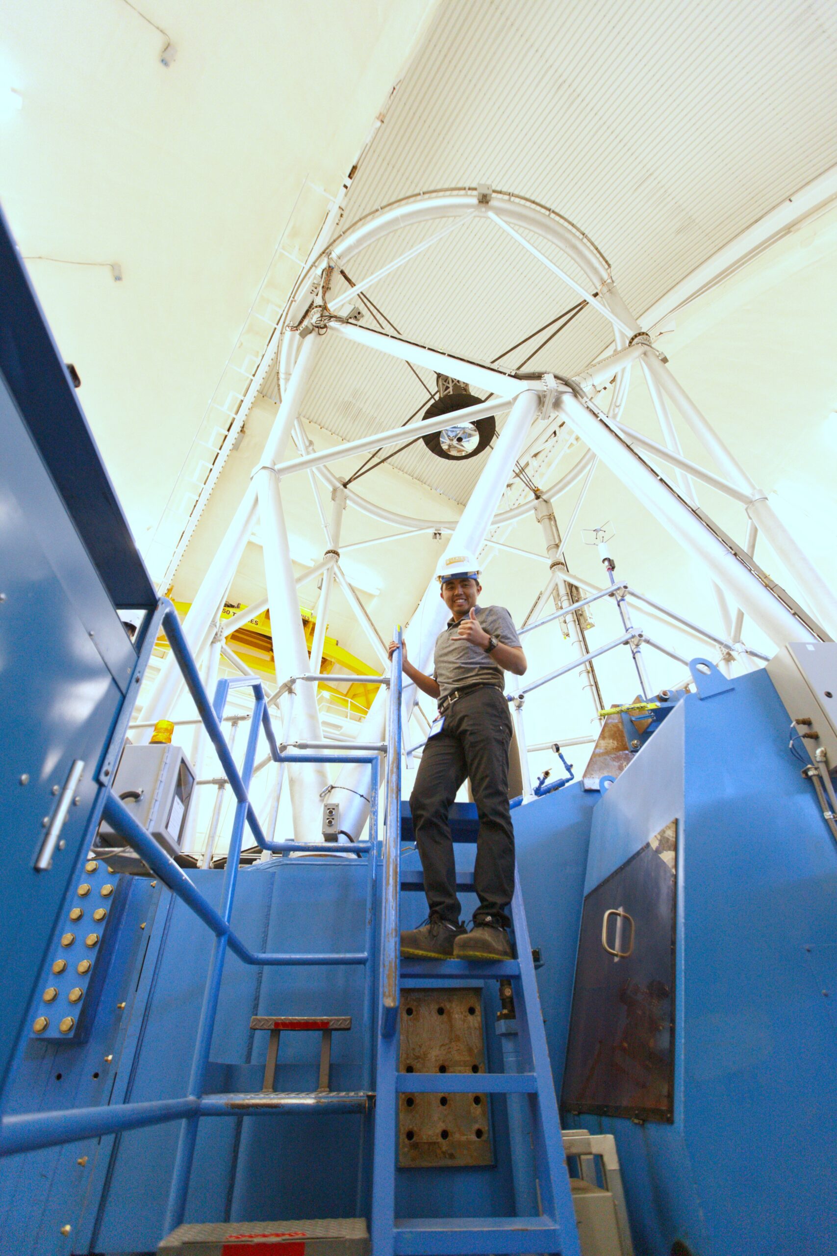 Intern Logan Sato at telescope
